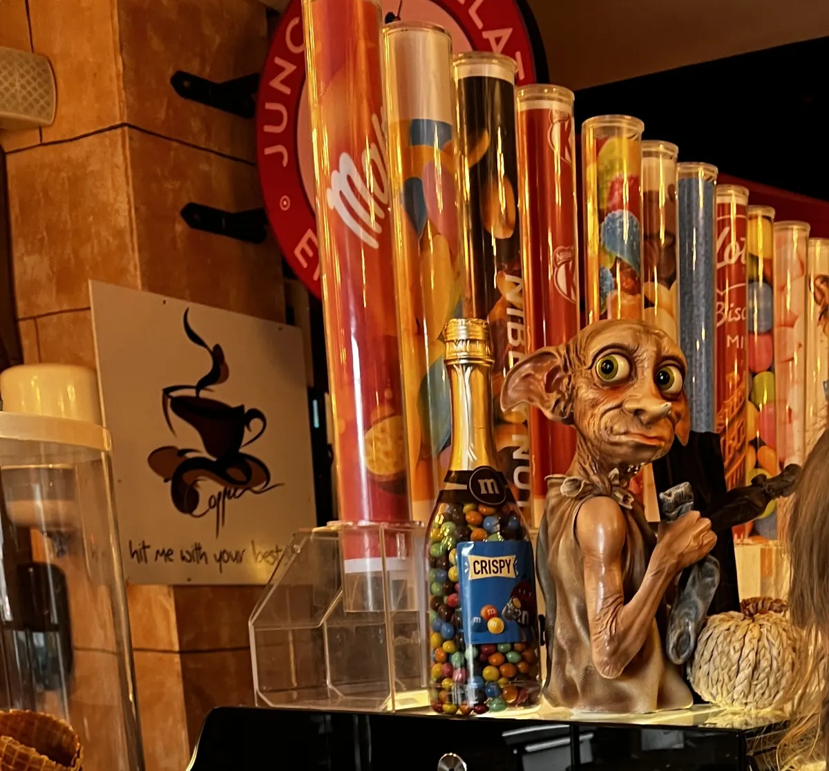 A small Dobby figure beside the sweet toppings at the Junction Café gelato counter